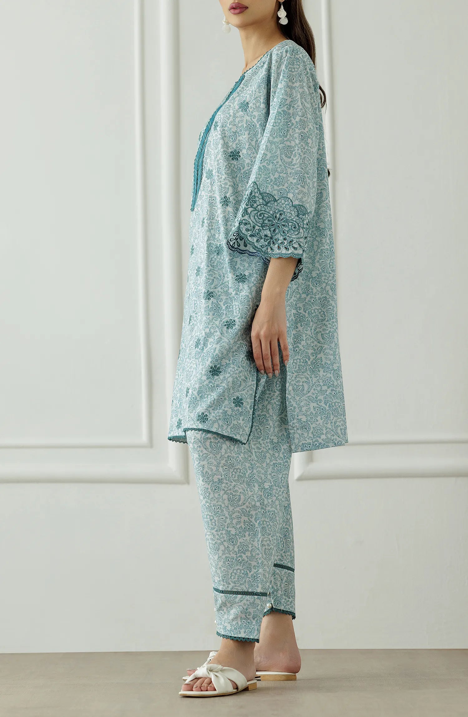 Woman wearing a light blue traditional outfit with floral patterns, Stitched Printed Lawn Shirt & Pant - 2 Piece Suits (Co-ord Set) - WRCC25S-2047