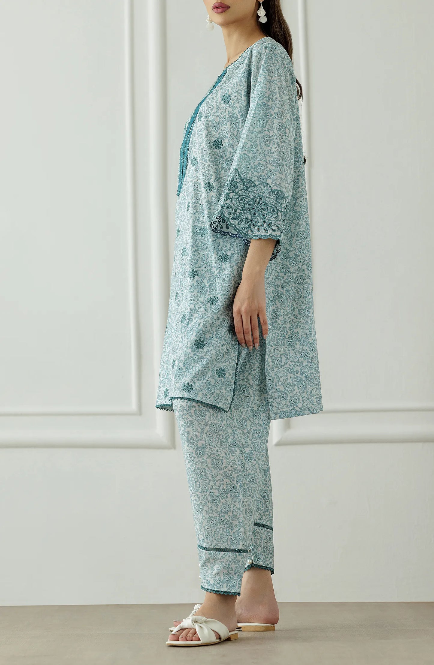 Woman wearing a light blue traditional outfit with floral patterns, Stitched Printed Lawn Shirt & Pant - 2 Piece Suits (Co-ord Set) - WRCC25S-2047