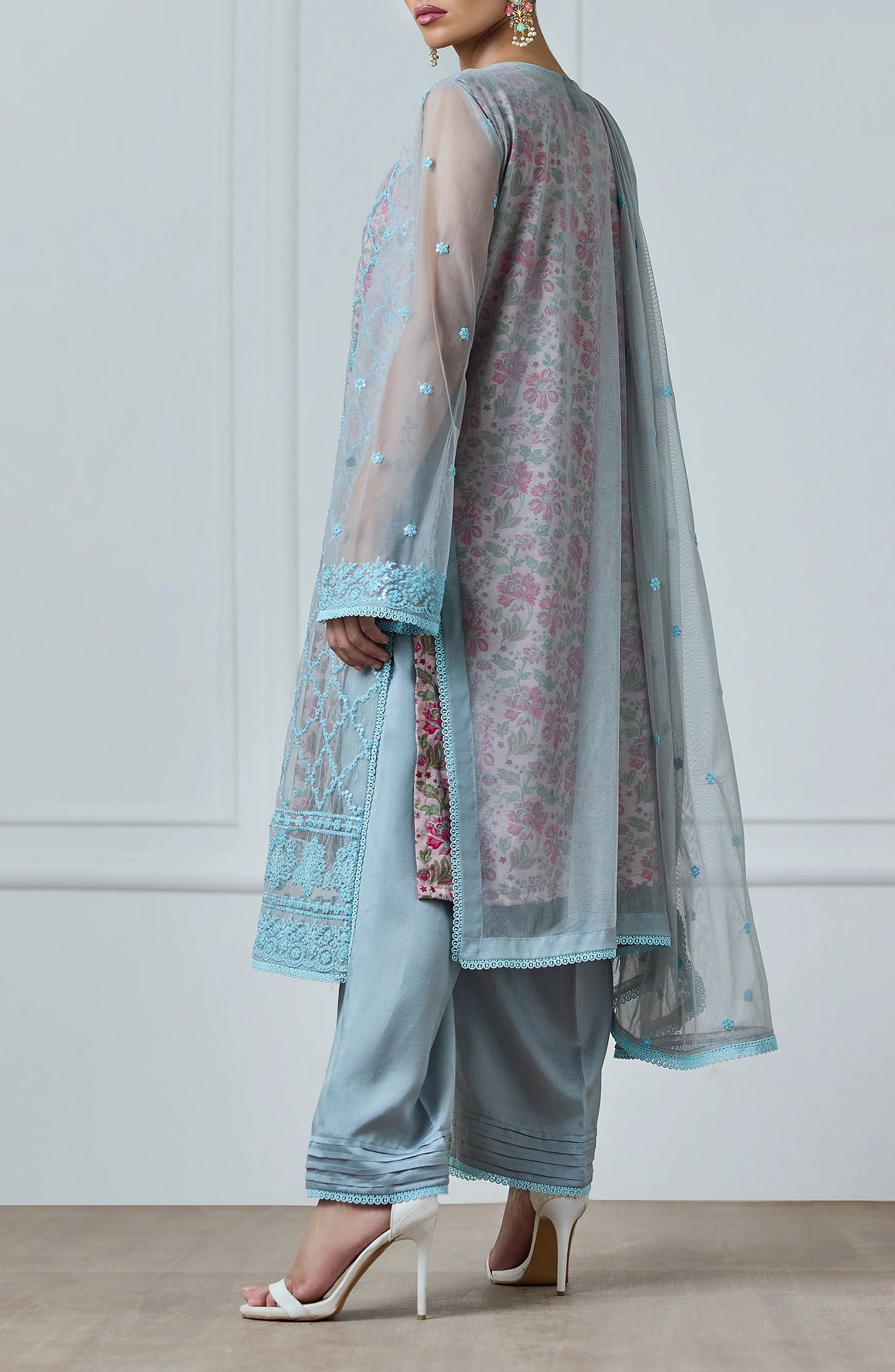 Woman wearing a light blue embroidered outfit with a matching dupatta against a dyed trouser. Stitched Luxury Festive Formal Poly Net Shirt Dupatta & Pant - 3 Piece Suits - WRFP24W-3002