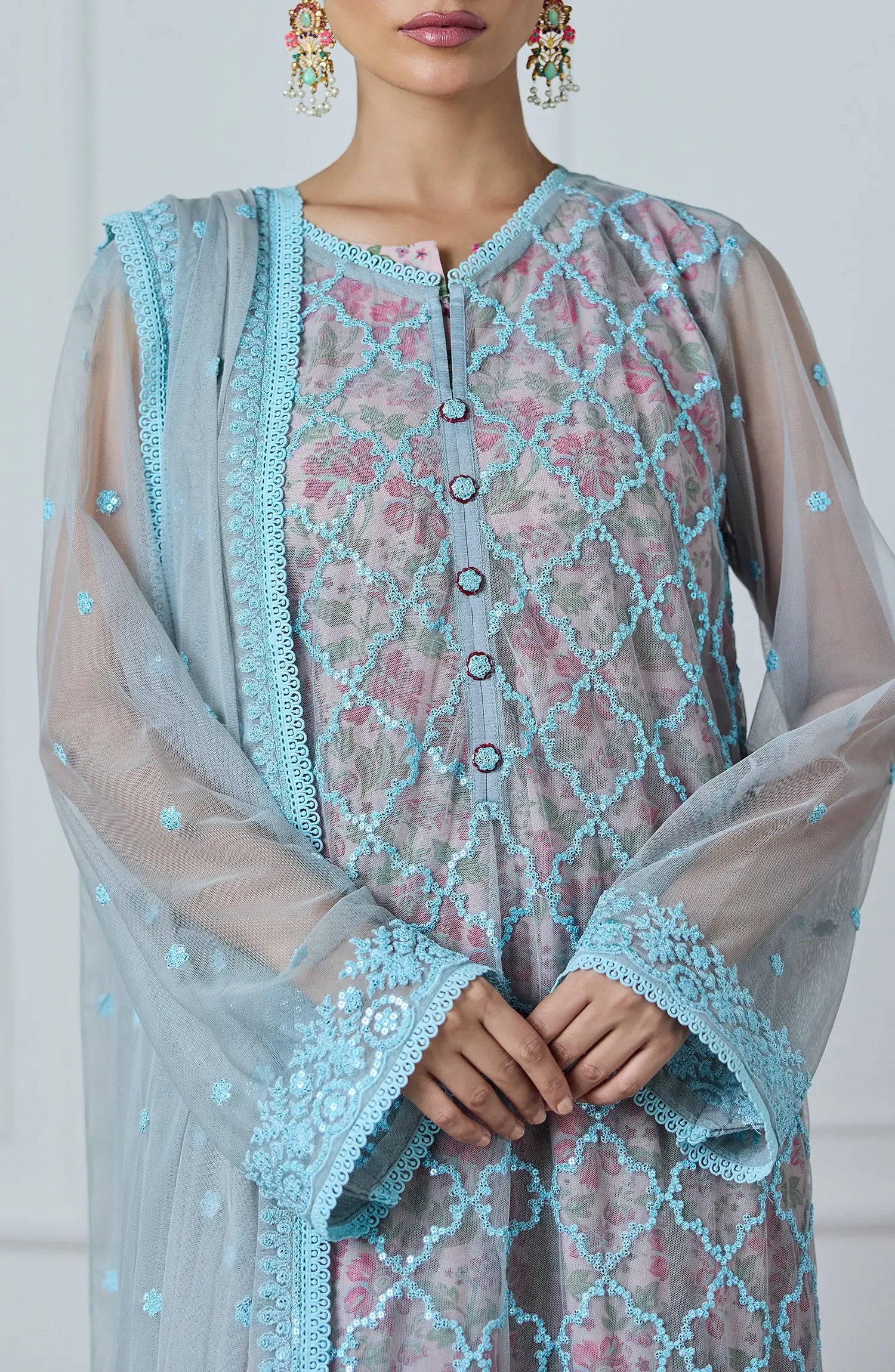 Woman wearing a light blue embroidered outfit with a matching dupatta against a dyed trouser. Stitched Luxury Festive Formal Poly Net Shirt Dupatta & Pant - 3 Piece Suits - WRFP24W-3002