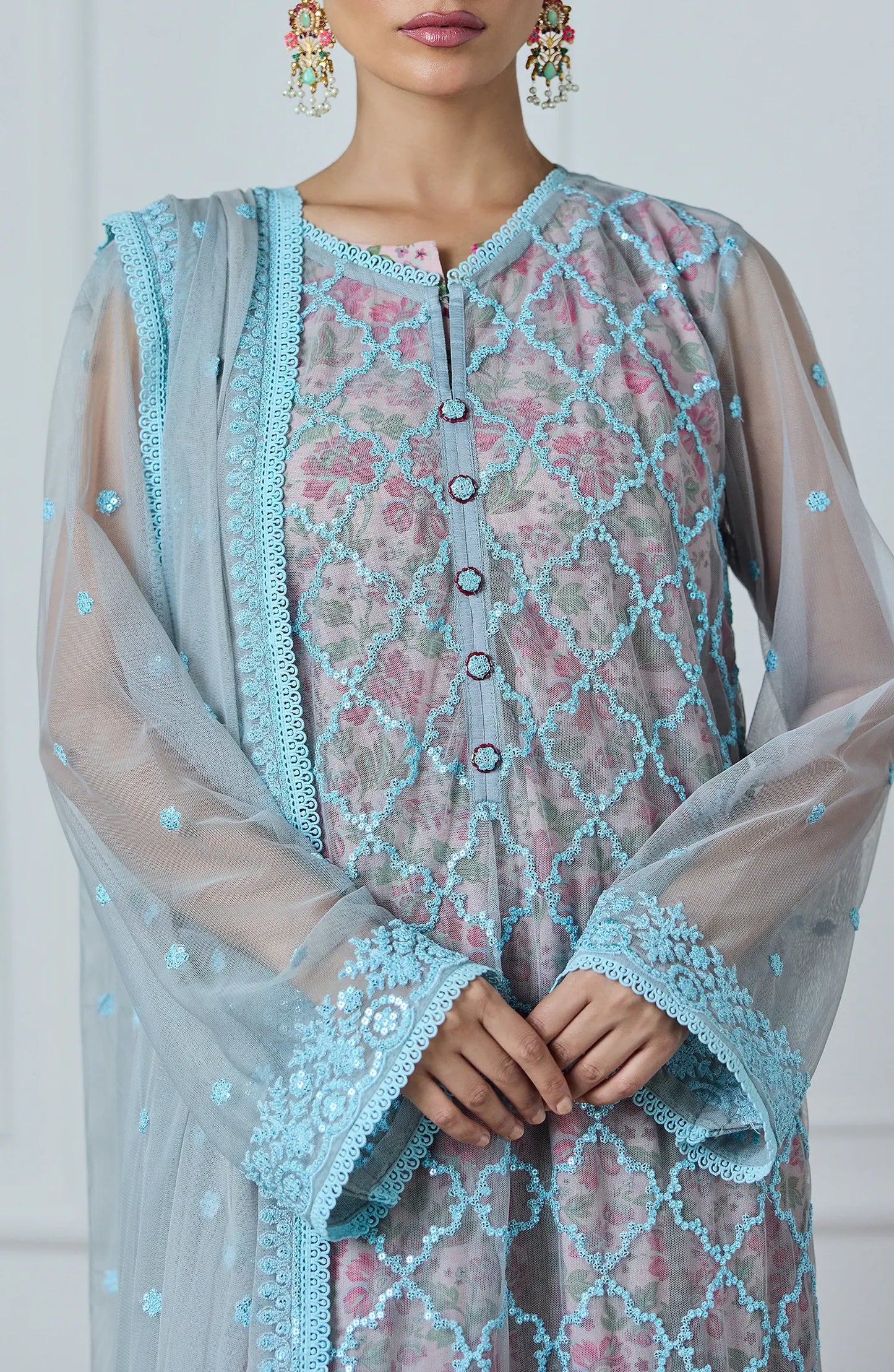 Woman wearing a light blue embroidered outfit with a matching dupatta against a dyed trouser. Stitched Luxury Festive Formal Poly Net Shirt Dupatta & Pant - 3 Piece Suits - WRFP24W-3002