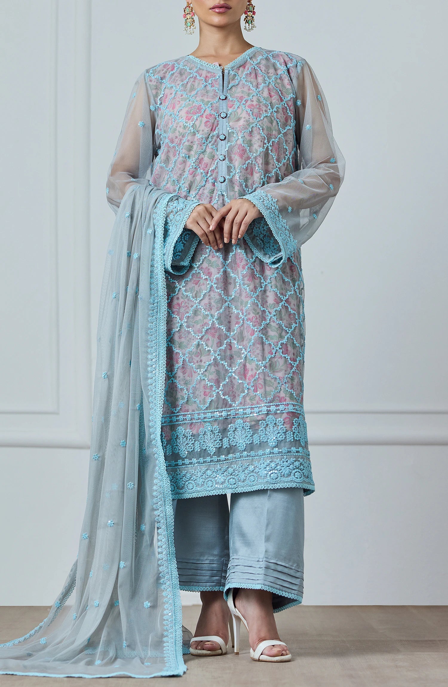 Woman wearing a light blue embroidered outfit with a matching dupatta against a dyed trouser. Stitched Luxury Festive Formal Poly Net Shirt Dupatta & Pant - 3 Piece Suits - WRFP24W-3002