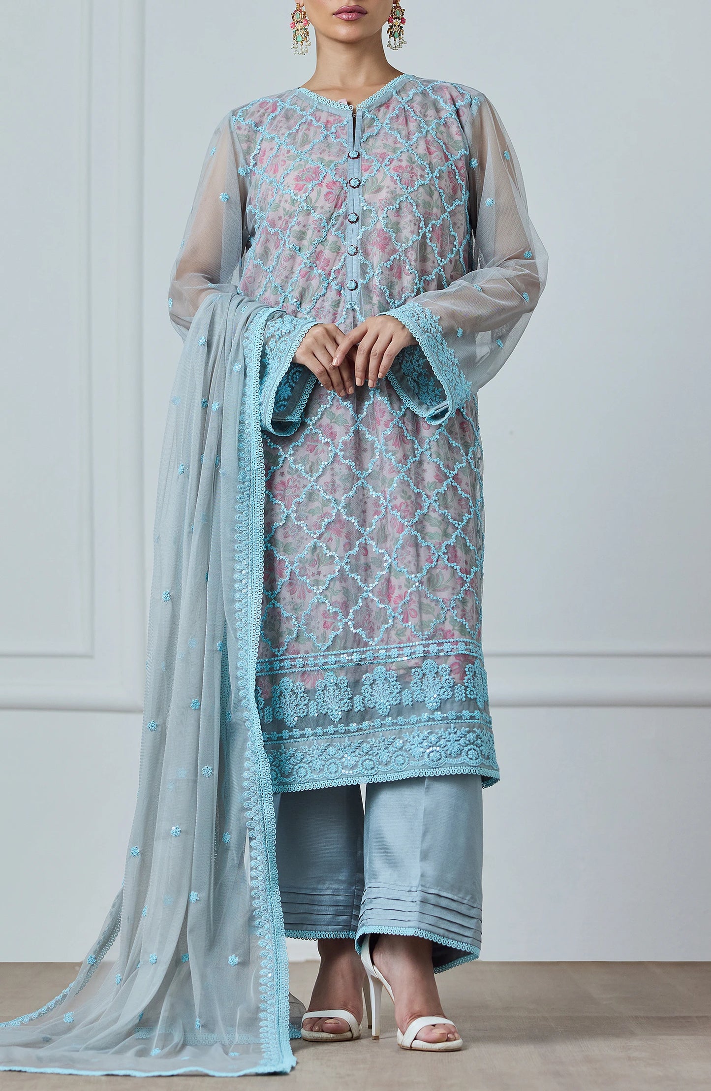 Woman wearing a light blue embroidered outfit with a matching dupatta against a dyed trouser. Stitched Luxury Festive Formal Poly Net Shirt Dupatta & Pant - 3 Piece Suits - WRFP24W-3002