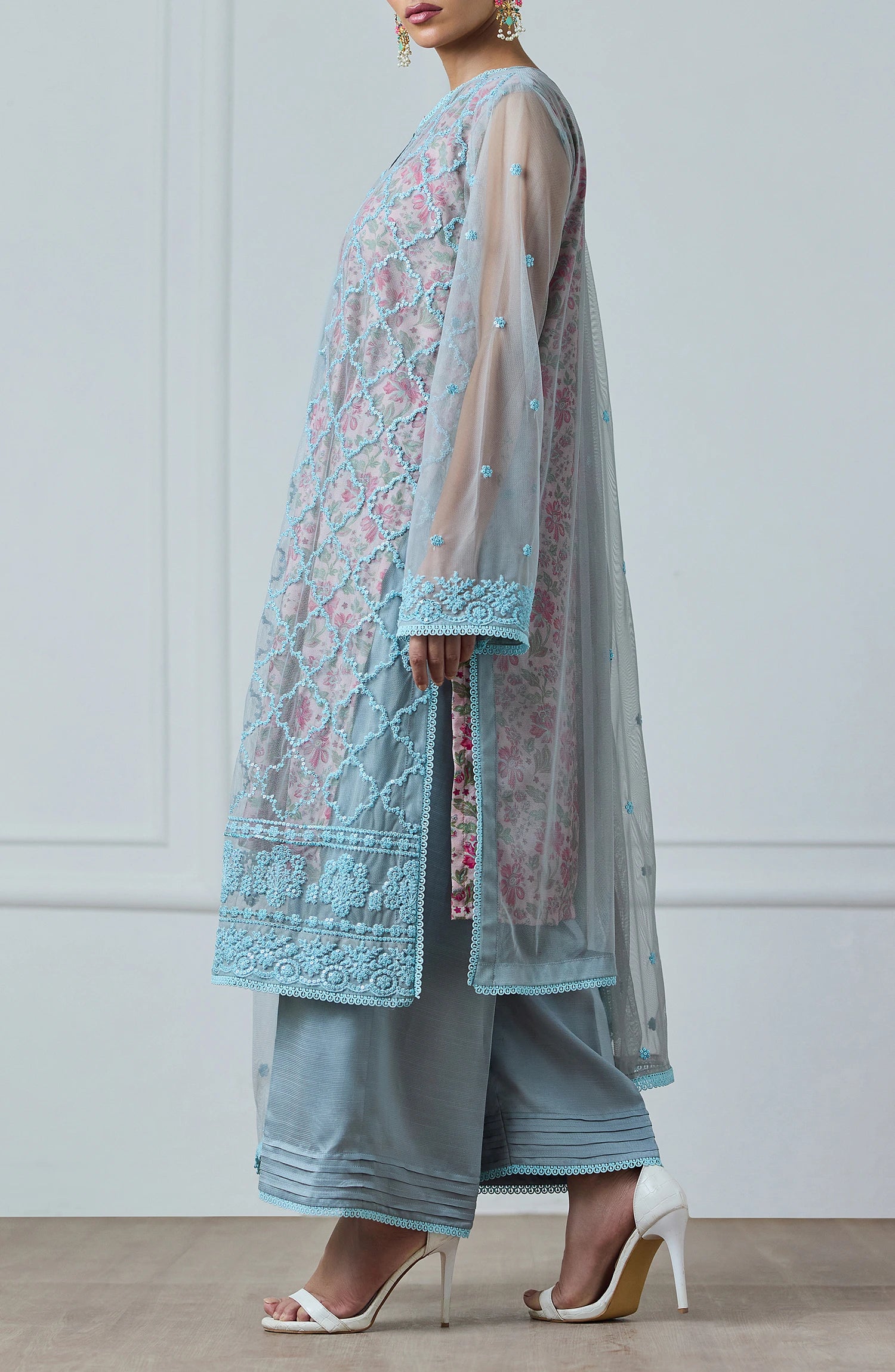 Woman wearing a light blue embroidered outfit with a matching dupatta against a dyed trouser. Stitched Luxury Festive Formal Poly Net Shirt Dupatta & Pant - 3 Piece Suits - WRFP24W-3002
