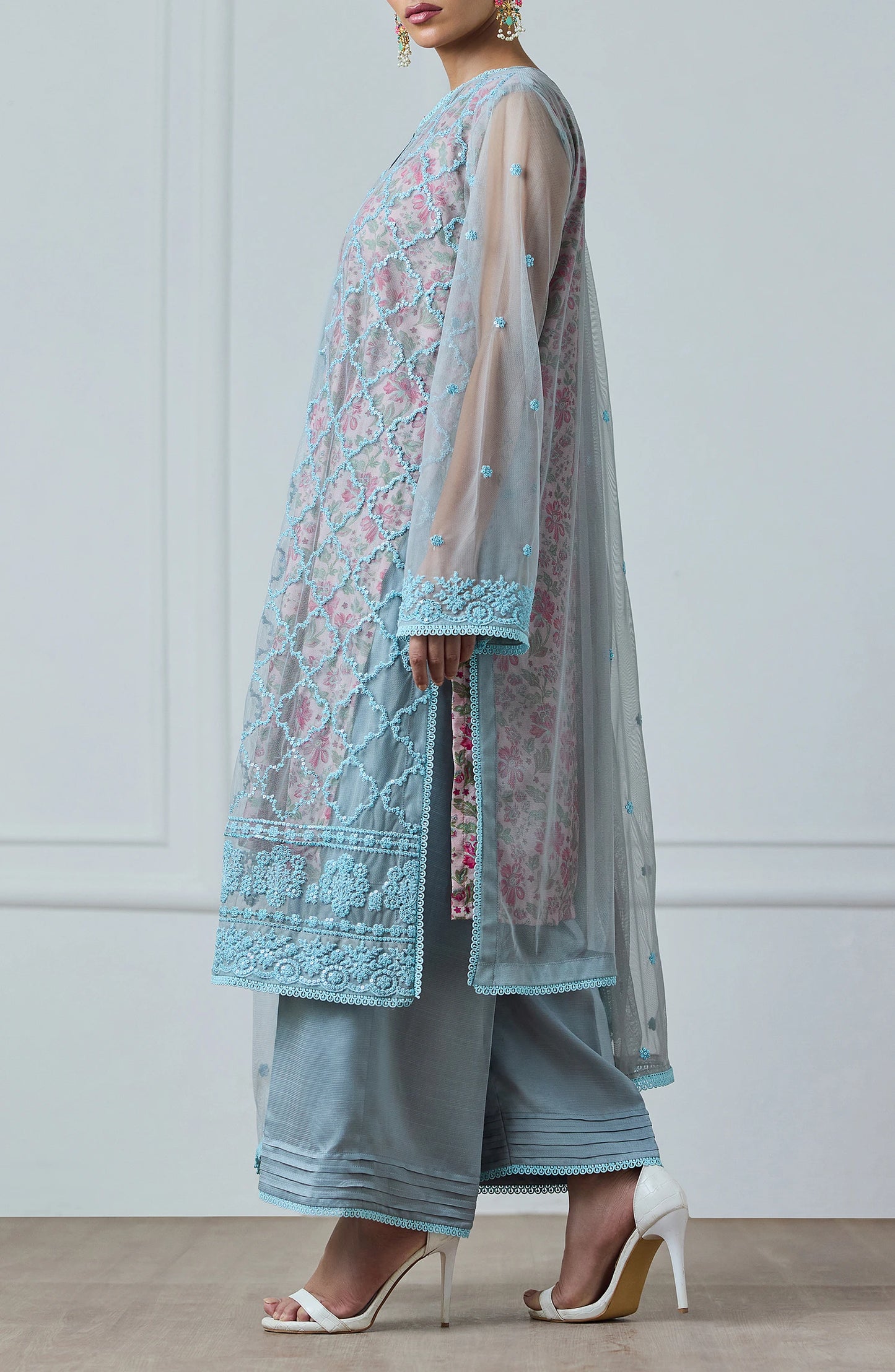 Woman wearing a light blue embroidered outfit with a matching dupatta against a dyed trouser. Stitched Luxury Festive Formal Poly Net Shirt Dupatta & Pant - 3 Piece Suits - WRFP24W-3002